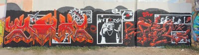 Red and Black Stylewriting by sik, fil and graff dinamics crew. This Graffiti is located in Lleida, Spain and was created in 2022. This Graffiti can be described as Stylewriting, Characters and Wall of Fame.