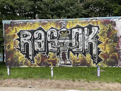 Chrome and Black and Yellow Stylewriting by Rasok. This Graffiti is located in Germany and was created in 2024. This Graffiti can be described as Stylewriting, Characters and Wall of Fame.