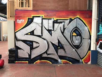 Chrome and Orange Stylewriting by hertse1 and smo__crew. This Graffiti is located in London, United Kingdom and was created in 2017.