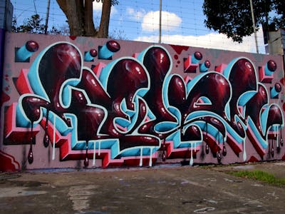 Red and Light Blue Stylewriting by Kezam. This Graffiti is located in Auckland, New Zealand and was created in 2022. This Graffiti can be described as Stylewriting and Wall of Fame.