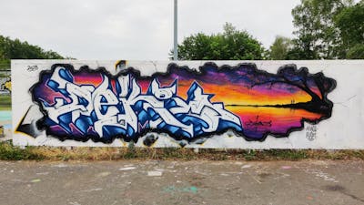 White and Blue and Colorful Stylewriting by Deki and AF Crew. This Graffiti is located in Wolfenbüttel, Germany and was created in 2023. This Graffiti can be described as Stylewriting and Wall of Fame.