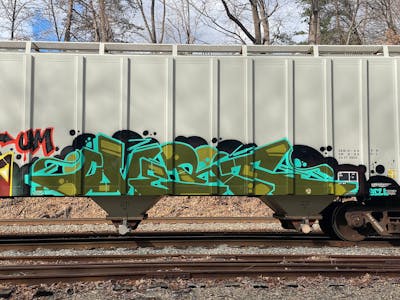 Green and Cyan and Black Stylewriting by OVERT. This Graffiti is located in United States and was created in 2023. This Graffiti can be described as Stylewriting, Trains and Freights.