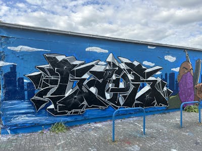 Black and Grey and Light Blue Stylewriting by Gaps and BrainTV. This Graffiti is located in Leipzig, Germany and was created in 2023. This Graffiti can be described as Stylewriting, Characters and Wall of Fame.