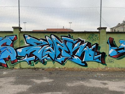 Light Blue Stylewriting by Zark. This Graffiti is located in Locate Triulzi, Italy and was created in 2024. This Graffiti can be described as Stylewriting and Wall of Fame.