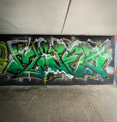 Green and Black Stylewriting by MINEZ. This Graffiti is located in Bayreuth, Germany and was created in 2022. This Graffiti can be described as Stylewriting and Wall of Fame.