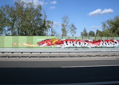 Red and Coralle and White Stylewriting by bros, NBSWE, RADICALS, rizok and R120K. This Graffiti is located in Leipzig, Germany and was created in 2020. This Graffiti can be described as Stylewriting, Characters and Street Bombing.