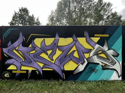 Yellow and Violet and Cyan Stylewriting by News. This Graffiti is located in Regensburg, Germany and was created in 2023.