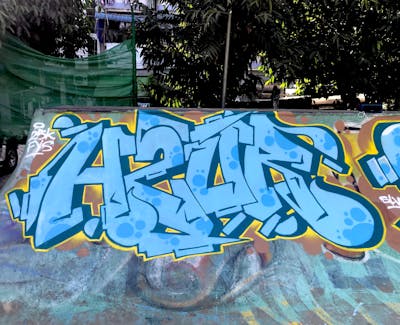 Light Blue and Yellow Stylewriting by Rush One and wsl. This Graffiti is located in Yangon city, Myanmar and was created in 2019. This Graffiti can be described as Stylewriting and Wall of Fame.