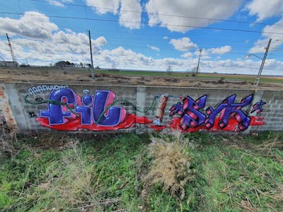 Violet and Red Stylewriting by fil, sik, mtr, is and urbs. This Graffiti is located in Lleida, Spain and was created in 2022. This Graffiti can be described as Stylewriting and Abandoned.