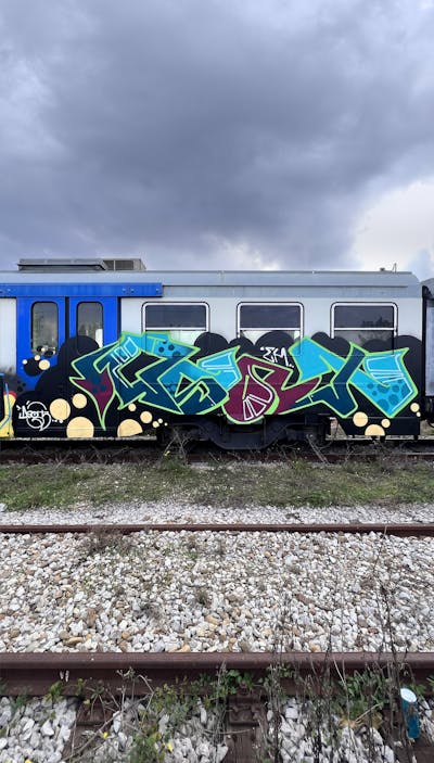 Light Blue and Light Green and Red Stylewriting by Asot. This Graffiti is located in Italy and was created in 2022. This Graffiti can be described as Stylewriting and Trains.