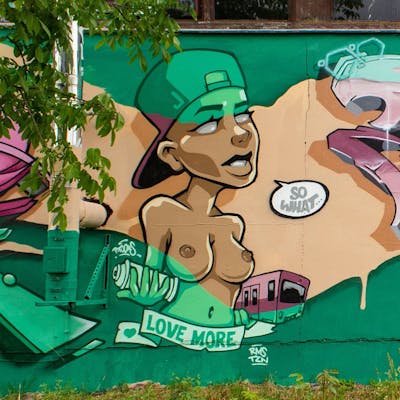 Beige and Light Green and Coralle Murals by Ptoons. This Graffiti is located in Radebeul, Germany and was created in 2022. This Graffiti can be described as Murals, Special and Characters.
