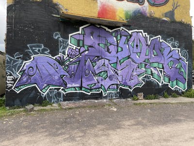Violet and Black and Cyan Stylewriting by Twis and Fumok. This Graffiti is located in Leipzig, Germany and was created in 2023. This Graffiti can be described as Stylewriting and Wall of Fame.