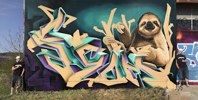 Beige and Cyan Stylewriting by casom and 7hells. This Graffiti is located in Radebeul, Germany and was created in 2020. This Graffiti can be described as Stylewriting, Characters and 3D.