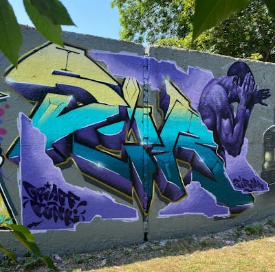 Cyan and Yellow and Violet Stylewriting by Sirom. This Graffiti is located in Zwickau, Germany and was created in 2023. This Graffiti can be described as Stylewriting and Characters.