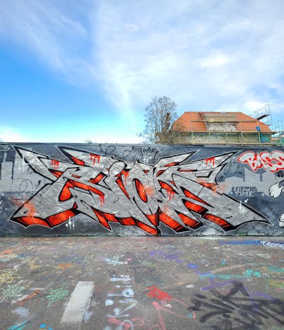 Chrome and Red and Grey Stylewriting by Riots. This Graffiti is located in Leipzig, Germany and was created in 2023. This Graffiti can be described as Stylewriting and Wall of Fame.