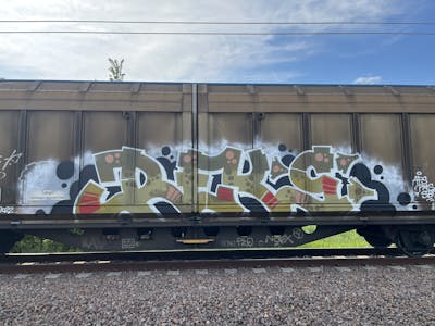 White and Light Green and Black Stylewriting by REKS. This Graffiti is located in Italy and was created in 2023. This Graffiti can be described as Stylewriting, Trains and Freights.