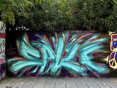 Cyan and Colorful Stylewriting by spliff one. This Graffiti is located in Thessaloniki, Greece and was created in 2022. This Graffiti can be described as Stylewriting and Wall of Fame.