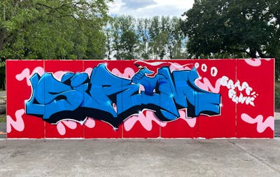 Red and Light Blue Stylewriting by Sirom. This Graffiti is located in Leipzig, Germany and was created in 2022. This Graffiti can be described as Stylewriting, Characters and Wall of Fame.