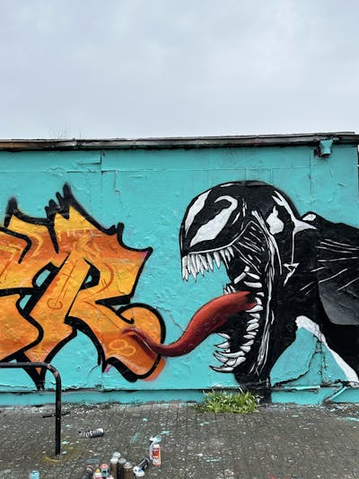 Black and White and Orange Characters by Gaps. This Graffiti is located in Leipzig, Germany and was created in 2023. This Graffiti can be described as Characters and Wall of Fame.