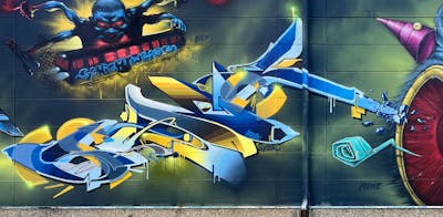 Yellow and Light Blue and Blue Stylewriting by Syck, ABS, KKP and Los Capitanos. This Graffiti is located in Waldaschaff, Germany and was created in 2022. This Graffiti can be described as Stylewriting and Characters.