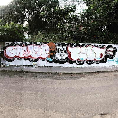 White Stylewriting by Grude and tivo. This Graffiti is located in salvador, Brazil and was created in 2021. This Graffiti can be described as Stylewriting, Characters and Wall of Fame.