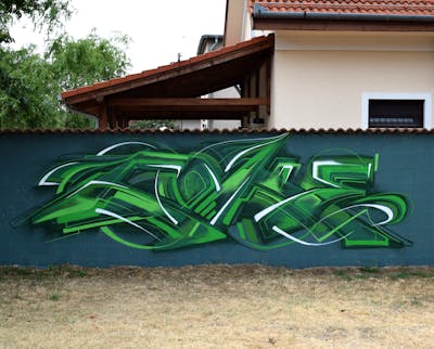 Light Green and Green Stylewriting by Coke. This Graffiti is located in Budapest, Hungary and was created in 2022.