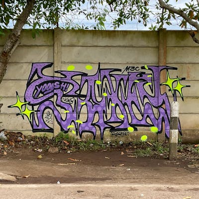 Violet and Yellow Stylewriting by M3C and Sakey. This Graffiti is located in Jambi City, Indonesia and was created in 2022. This Graffiti can be described as Stylewriting and Street Bombing.