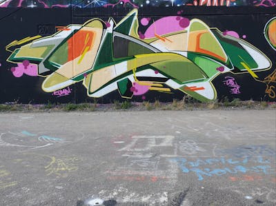 Beige and Green and Colorful Stylewriting by Dirt. This Graffiti is located in Leipzig, Germany and was created in 2022. This Graffiti can be described as Stylewriting and Wall of Fame.