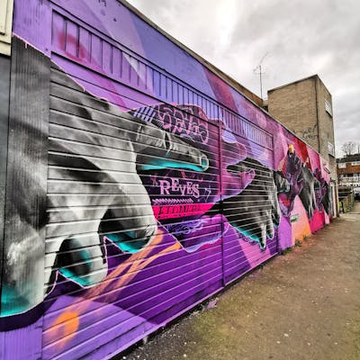 Violet and Coralle and Grey Characters by SIDOK and Reves. This Graffiti is located in London, United Kingdom and was created in 2023. This Graffiti can be described as Characters and Murals.