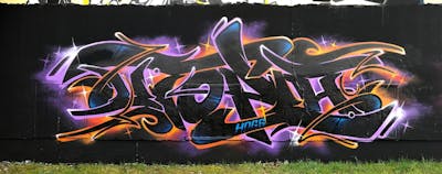 Black and Orange and Violet Stylewriting by Utopia. This Graffiti is located in Germany and was created in 2021. This Graffiti can be described as Stylewriting and Wall of Fame.