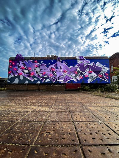 Violet and Grey and Blue Atmosphere by Raitz. This Graffiti is located in Germany and was created in 2023. This Graffiti can be described as Atmosphere, Stylewriting and Cars.