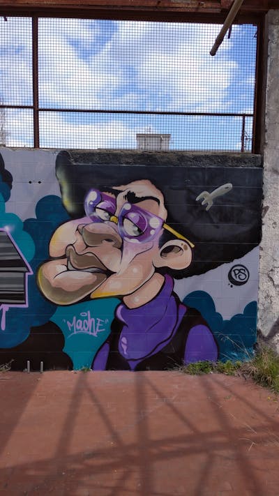 Violet and Beige and Black Characters by Mache. This Graffiti is located in Naples, Italy and was created in 2023.