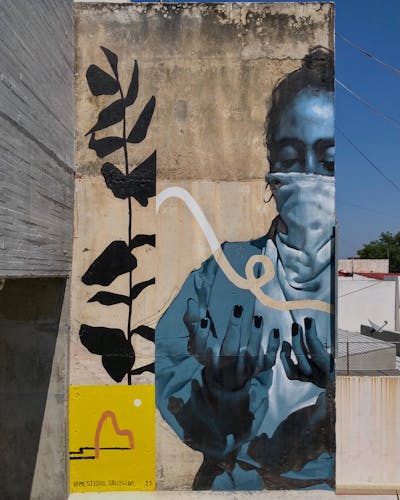 Grey Characters by MESTIZOS.collective. This Graffiti is located in Guadalajara, Mexico and was created in 2021. This Graffiti can be described as Characters and Murals.