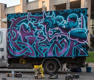 Violet and Cyan Stylewriting by FORK and Selok. This Graffiti is located in Moscow, Russian Federation and was created in 2017. This Graffiti can be described as Stylewriting, Characters and Cars.