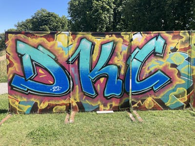 Colorful Stylewriting by Dkc, Tram and Djin. This Graffiti is located in Bern, Switzerland and was created in 2022.