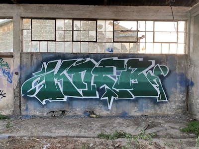 Cyan and White Stylewriting by KNEB. This Graffiti is located in Cyprus and was created in 2022. This Graffiti can be described as Stylewriting and Abandoned.