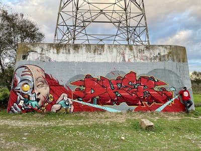 Red and Colorful Stylewriting by Aker and Ypso. This Graffiti is located in Barcelona, Spain and was created in 2021. This Graffiti can be described as Stylewriting, Characters and Abandoned.