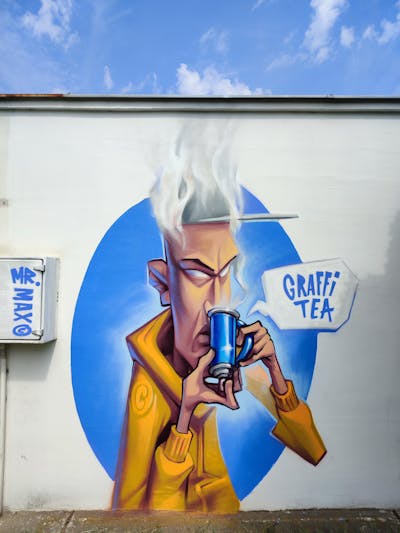 Light Blue and Orange Characters by Mr.Max and OCrew. This Graffiti is located in Poland and was created in 2023.