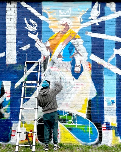 Light Blue and Colorful Characters by Tris. This Graffiti is located in London, United Kingdom and was created in 2024. This Graffiti can be described as Characters and Atmosphere.