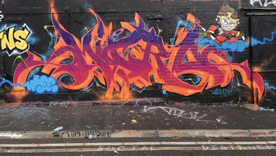 Orange and Colorful Stylewriting by Micro79. This Graffiti is located in Newcastle, United Kingdom and was created in 2022. This Graffiti can be described as Stylewriting, Characters and Wall of Fame.