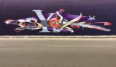 Violet and Colorful Stylewriting by Syck, ABS, KKP and Los Capitanos. This Graffiti is located in bochum, Germany and was created in 2019. This Graffiti can be described as Stylewriting and Wall of Fame.