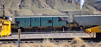 Cyan and Black Trains by Duel. This Graffiti is located in United States and was created in 2024. This Graffiti can be described as Trains, Freights, Roll Up and Wholecars.