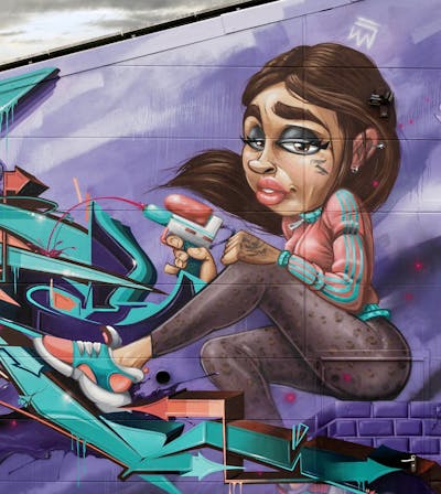 Violet and Cyan and Brown Stylewriting by Tokk. This Graffiti is located in Germany and was created in 2023. This Graffiti can be described as Stylewriting, Characters, Streetart and Murals.