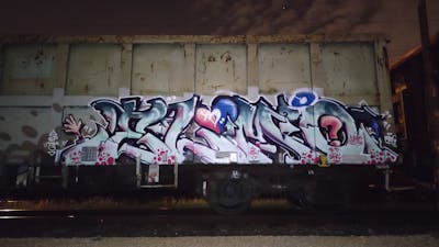 Grey Stylewriting by DCK, Elmo and ALL CAPS COLLECTIVE. This Graffiti is located in Hungary and was created in 2021. This Graffiti can be described as Stylewriting, Freights and Trains.