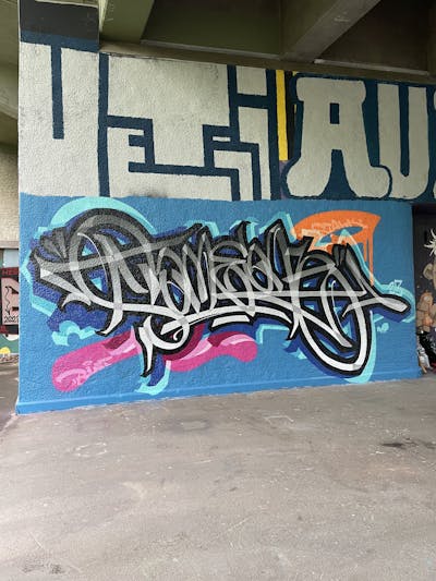 Grey and Light Blue Stylewriting by Someone. This Graffiti is located in Basel, Switzerland and was created in 2023. This Graffiti can be described as Stylewriting and Wall of Fame.