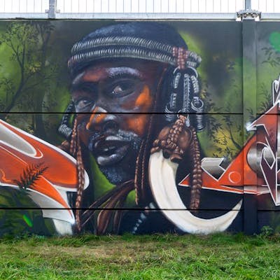 Brown and Colorful Characters by AIDN. This Graffiti is located in Hamburg, Germany and was created in 2021. This Graffiti can be described as Characters and Wall of Fame.