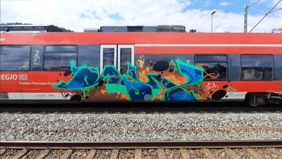 Cyan and Blue and Brown Stylewriting by Roweo and mtl crew. This Graffiti is located in Germany and was created in 2022. This Graffiti can be described as Stylewriting and Trains.