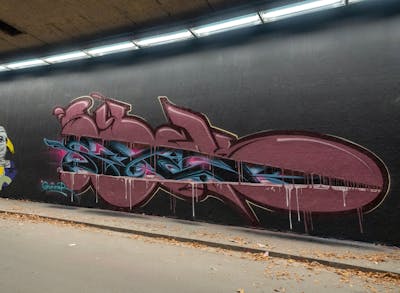 Coralle and Light Blue and Black Stylewriting by Syck, ABS, KKP and Los Capitanos. This Graffiti is located in bochum, Germany and was created in 2023. This Graffiti can be described as Stylewriting and Wall of Fame.
