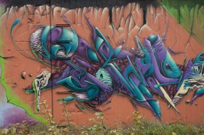 Cyan and Violet Stylewriting by STEM. This Graffiti is located in Munich, Germany and was created in 2020. This Graffiti can be described as Stylewriting and 3D.