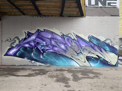 Violet and Cyan Stylewriting by ARSONE. This Graffiti is located in Canada and was created in 2024. This Graffiti can be described as Stylewriting and Wall of Fame.
